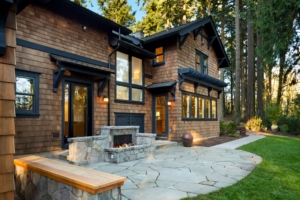Outdoor fireplace on patio in front house